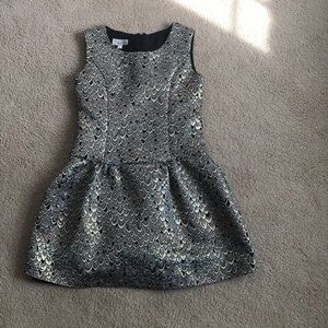 A youth dress with a feather pattern